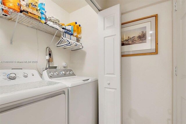 15073 SW 119th Ln, Miami, FL 33196 - clothes washing area with washing machine and clothes dryer