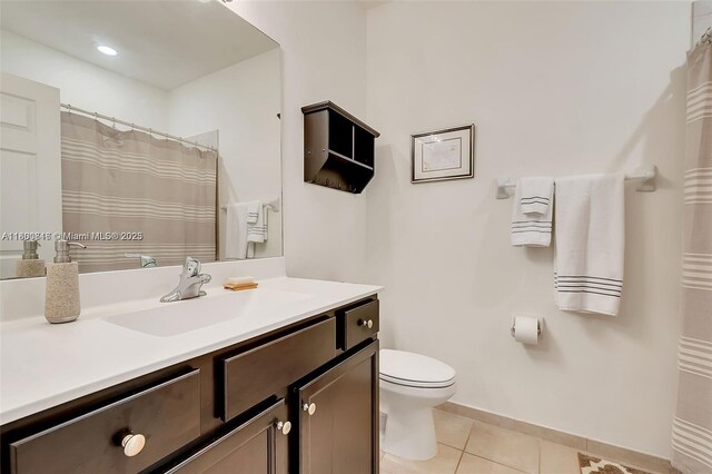 15073 SW 119th Ln, Miami, FL 33196 - bathroom featuring tile patterned floors, vanity, toilet, and baseboards