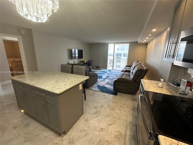 1865 S Ocean Dr Unit 17C, Hallandale Beach, FL 33009 - bedroom featuring a chandelier, access to exterior, a textured ceiling, and recessed lighting