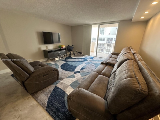 1865 S Ocean Dr Unit 17C, Hallandale Beach, FL 33009 - living room with a textured ceiling, recessed lighting, and baseboards