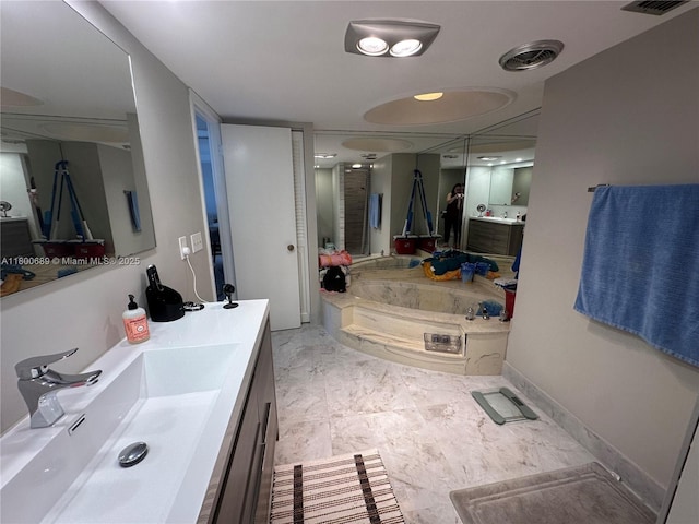 1865 S Ocean Dr Unit 17C, Hallandale Beach, FL 33009 - bathroom featuring vanity, a bath, and baseboards