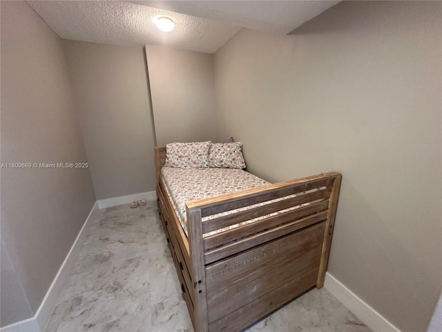 1865 S Ocean Dr Unit 17C, Hallandale Beach, FL 33009 - bedroom featuring baseboards and a textured ceiling