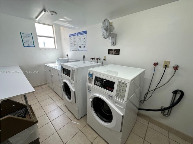 1865 S Ocean Dr Unit 17C, Hallandale Beach, FL 33009 - communal laundry room with washer and dryer, light tile patterned floors, and baseboards