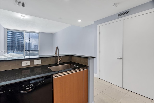 1060 Brickell Ave Unit 1811, Miami, FL 33131 - kitchen with dishwasher, a sink, light tile patterned flooring, dark stone countertops, and open floor plan