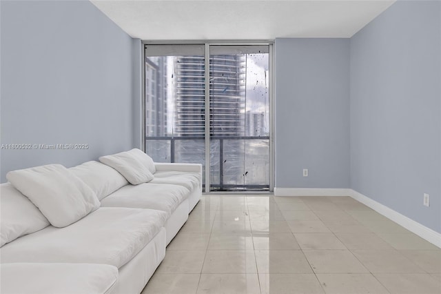 1060 Brickell Ave Unit 1811, Miami, FL 33131 - living room with expansive windows, baseboards, and light tile patterned floors