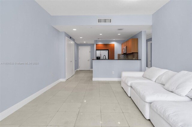 1060 Brickell Ave Unit 1811, Miami, FL 33131 - living room featuring light tile patterned flooring, baseboards, and recessed lighting