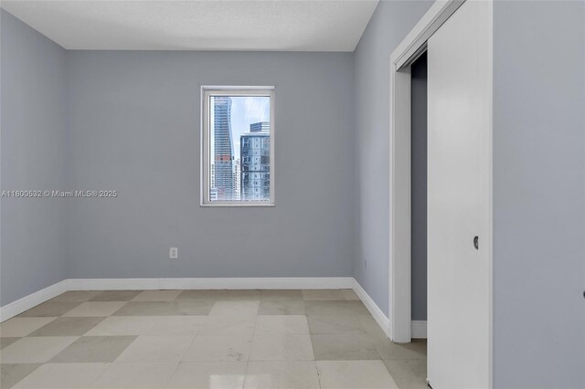 1060 Brickell Ave Unit 1811, Miami, FL 33131 - spare room with baseboards