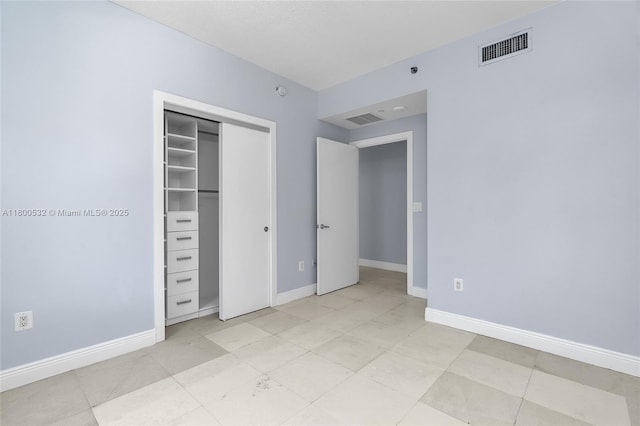 1060 Brickell Ave Unit 1811, Miami, FL 33131 - unfurnished bedroom featuring a closet and baseboards