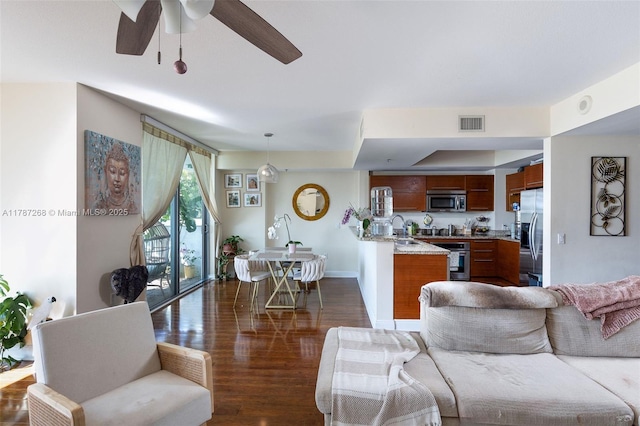 2681 N Flamingo Rd Unit Th4S, Sunrise, FL 33323 - living room with dark wood finished floors, ceiling fan, and baseboards