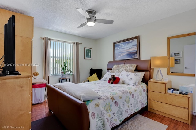 621 NW 157th Ave, Pembroke Pines, FL 33028 - bedroom with wood finished floors, a textured ceiling, and a ceiling fan