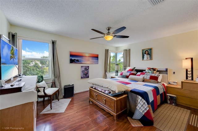 621 NW 157th Ave, Pembroke Pines, FL 33028 - bedroom featuring wood finished floors, a textured ceiling, a ceiling fan, and baseboards