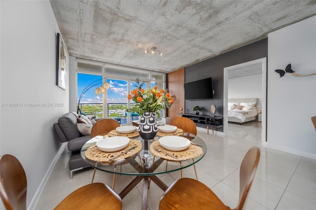 3250 NE 1st Ave Unit 806, Miami, FL 33137 - dining area with baseboards and light tile patterned floors