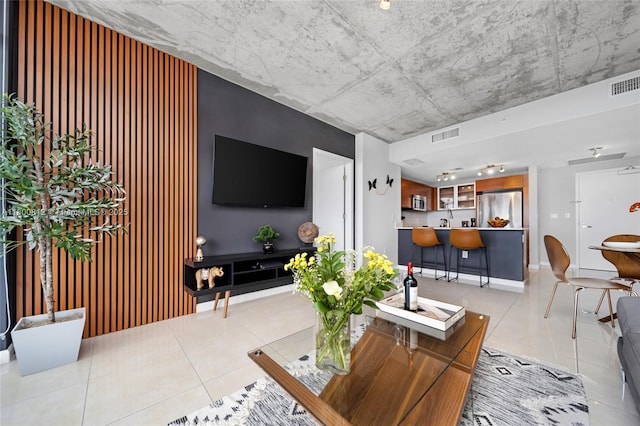3250 NE 1st Ave Unit 806, Miami, FL 33137 - living area featuring light tile patterned floors and baseboards