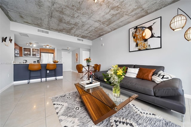 3250 NE 1st Ave Unit 806, Miami, FL 33137 - living room with light tile patterned floors and baseboards