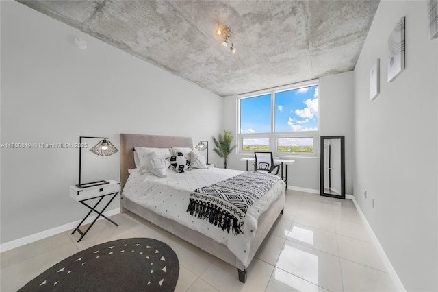 3250 NE 1st Ave Unit 806, Miami, FL 33137 - bedroom featuring baseboards and tile patterned floors