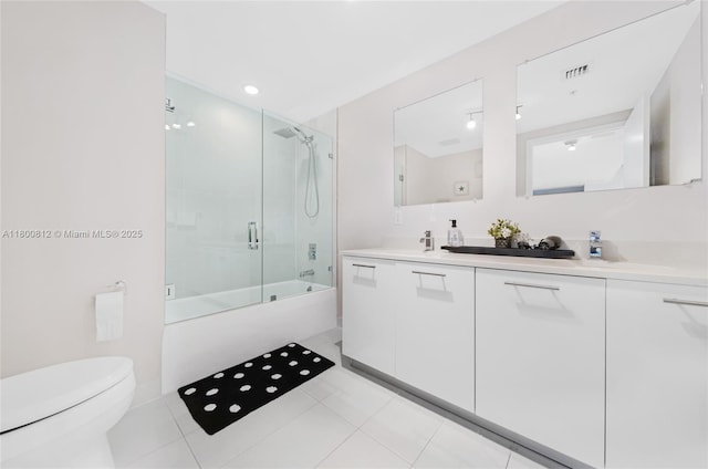 3250 NE 1st Ave Unit 806, Miami, FL 33137 - full bath featuring toilet, double vanity, enclosed tub / shower combo, and tile patterned flooring