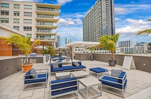 3250 NE 1st Ave Unit 806, Miami, FL 33137 - view of patio with an outdoor living space and a city view