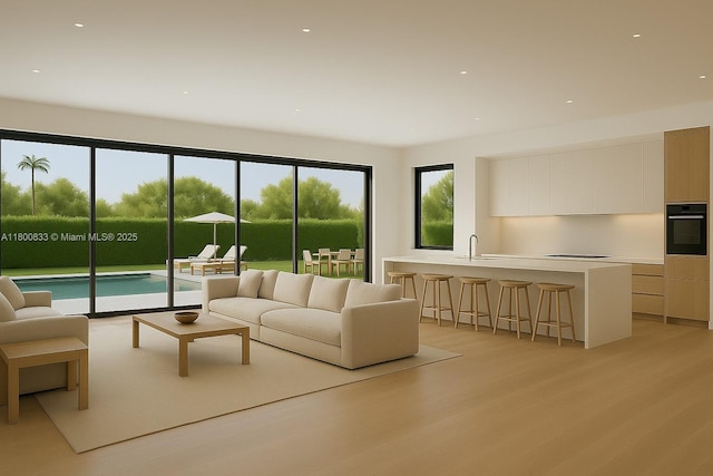 960 NE 121st St, Biscayne Park, FL 33161 - living room featuring light wood finished floors and recessed lighting