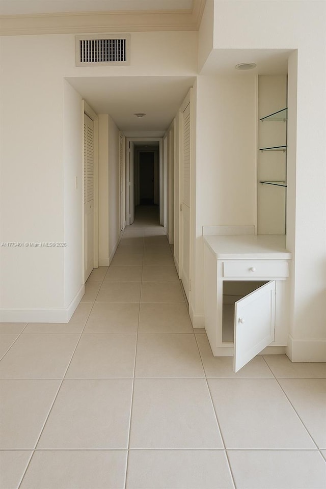 800 NE 199th St Unit 105D, Miami, FL 33179 - corridor with light tile patterned flooring and baseboards