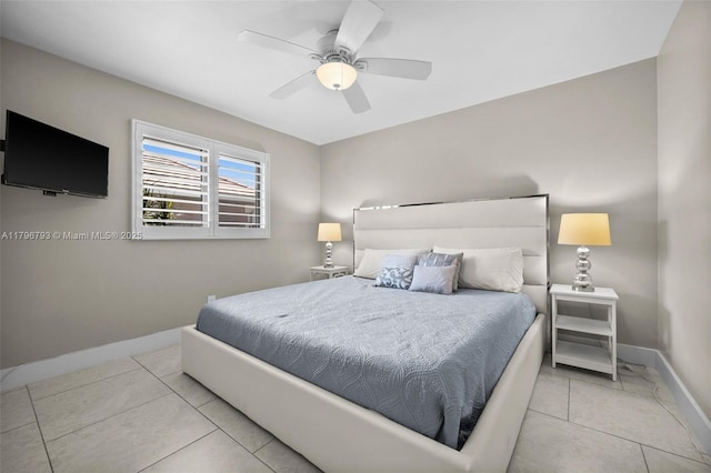621 SW 49th Ln, Cape Coral, FL 33914 - bedroom with baseboards and a ceiling fan