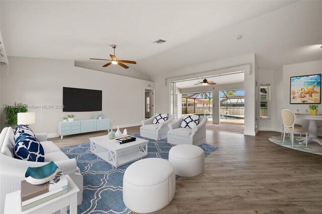 4344 Agualinda Blvd, Cape Coral, FL 33914 - living area featuring a ceiling fan, wood finished floors, vaulted ceiling, and baseboards