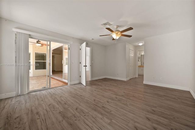 4344 Agualinda Blvd, Cape Coral, FL 33914 - unfurnished room featuring a ceiling fan, wood finished floors, and baseboards