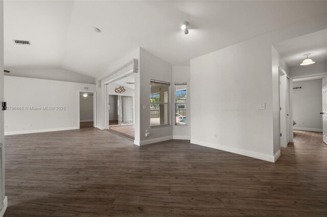 4344 Agualinda Blvd, Cape Coral, FL 33914 - empty room with lofted ceiling, dark wood finished floors, and baseboards
