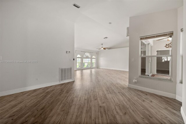 4344 Agualinda Blvd, Cape Coral, FL 33914 - spare room featuring a ceiling fan, wood finished floors, baseboards, and lofted ceiling