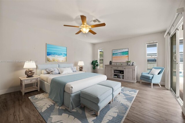 4344 Agualinda Blvd, Cape Coral, FL 33914 - bedroom with multiple windows, baseboards, wood finished floors, and a ceiling fan