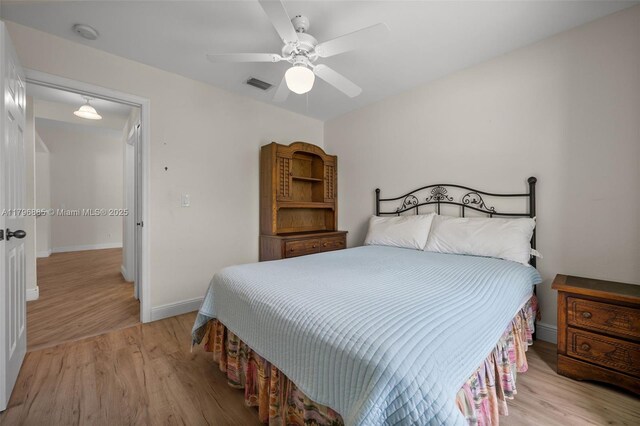 4344 Agualinda Blvd, Cape Coral, FL 33914 - bedroom with light wood-type flooring, baseboards, and a ceiling fan