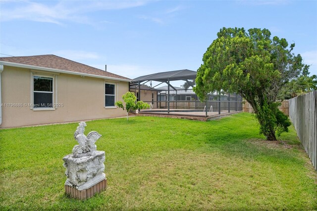 4344 Agualinda Blvd, Cape Coral, FL 33914 - view of yard featuring glass enclosure and a swimming pool