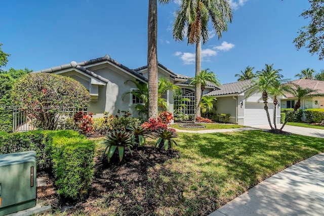 218 Egret Ct, Weston, FL 33327 - view of front facade featuring stucco siding, a tile roof, an attached garage, concrete driveway, and a front yard