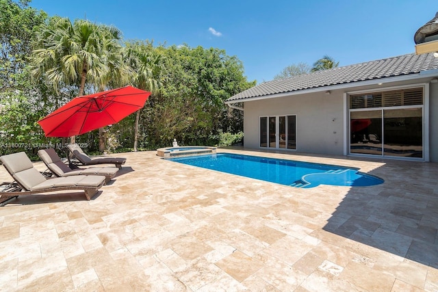 218 Egret Ct, Weston, FL 33327 - view of pool featuring a patio area, a pool with connected hot tub, and french doors