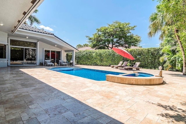 218 Egret Ct, Weston, FL 33327 - view of swimming pool with a patio and a pool with connected hot tub