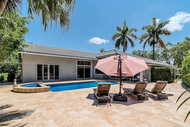 218 Egret Ct, Weston, FL 33327 - view of swimming pool with a patio area and a pool with connected hot tub