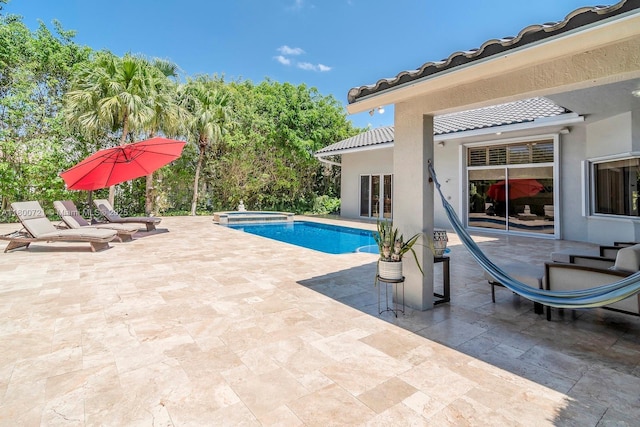 218 Egret Ct, Weston, FL 33327 - view of pool with a patio area and a pool with connected hot tub