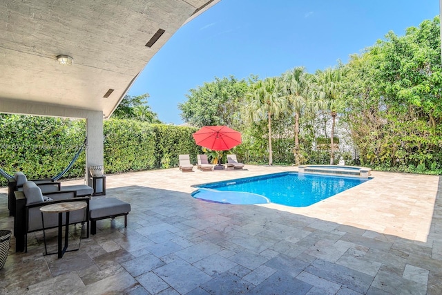 218 Egret Ct, Weston, FL 33327 - view of pool featuring a patio area and a pool with connected hot tub