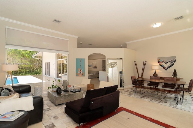 218 Egret Ct, Weston, FL 33327 - living room featuring arched walkways, ornamental molding, and light tile patterned floors