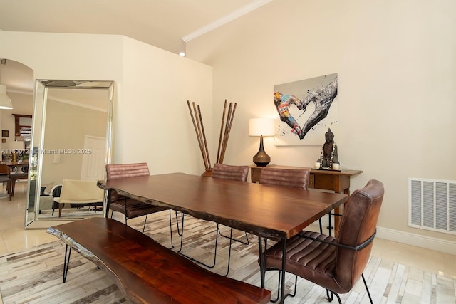 218 Egret Ct, Weston, FL 33327 - dining room featuring ornamental molding, baseboards, and arched walkways