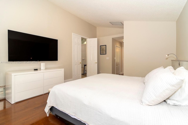 218 Egret Ct, Weston, FL 33327 - bedroom with lofted ceiling and wood finished floors