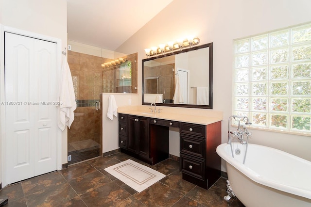 218 Egret Ct, Weston, FL 33327 - bathroom featuring a stall shower, lofted ceiling, vanity, and a freestanding bath