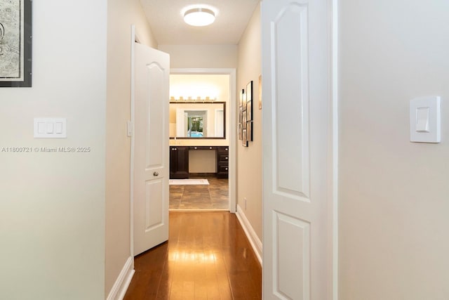 218 Egret Ct, Weston, FL 33327 - hallway featuring hardwood / wood-style flooring and baseboards