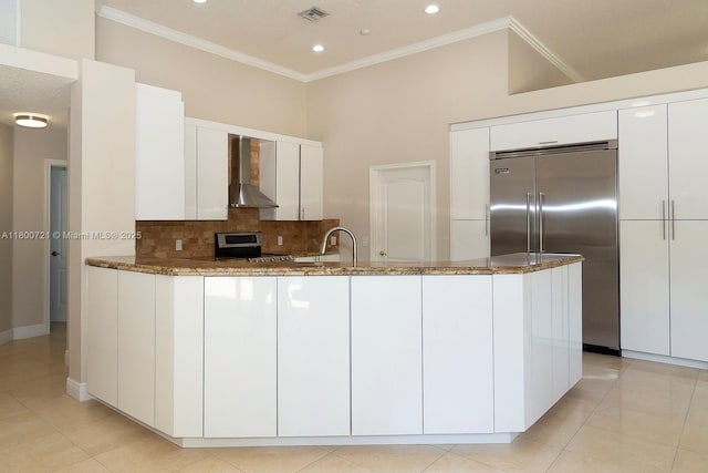 218 Egret Ct, Weston, FL 33327 - kitchen featuring wall chimney range hood, appliances with stainless steel finishes, ornamental molding, dark stone counters, and recessed lighting