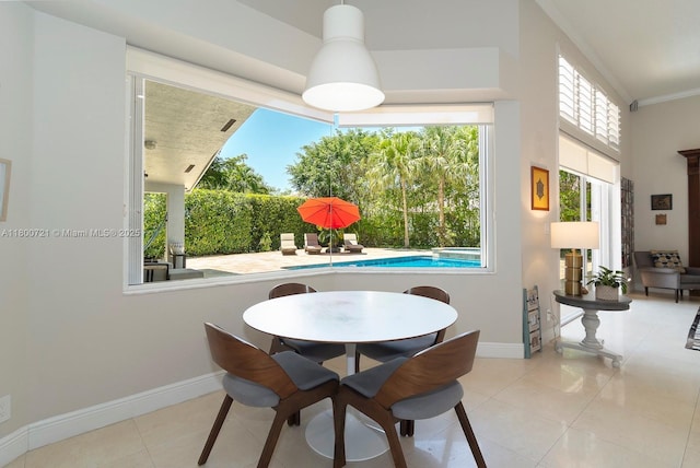 218 Egret Ct, Weston, FL 33327 - dining space featuring baseboards, tile patterned flooring, and ornamental molding