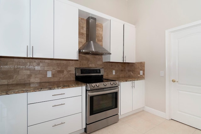 218 Egret Ct, Weston, FL 33327 - kitchen with stainless steel electric stove, wall chimney exhaust hood, tasteful backsplash, white cabinetry, and dark stone counters