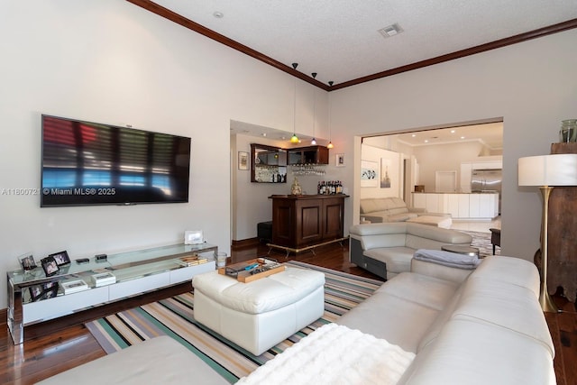 218 Egret Ct, Weston, FL 33327 - living area with crown molding, wood finished floors, and a textured ceiling