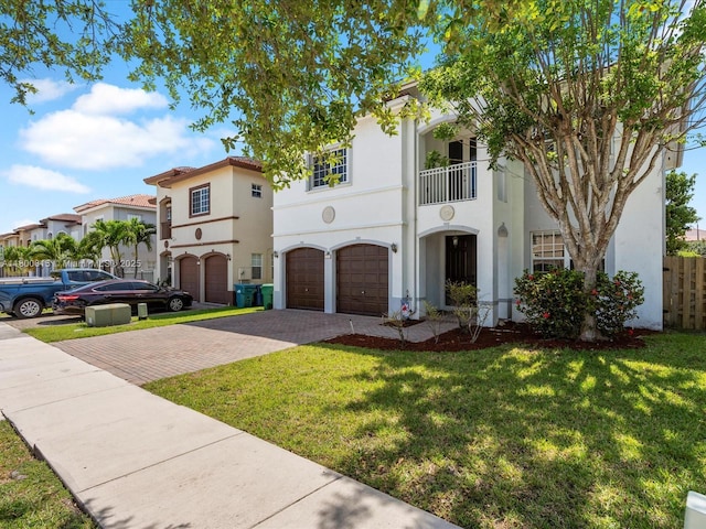 17616 SW 135th Ave, Miami, FL 33177 - view of front of home featuring decorative driveway, stucco siding, an attached garage, and a front lawn