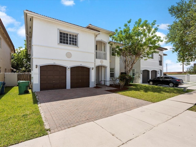 17616 SW 135th Ave, Miami, FL 33177 - mediterranean / spanish home featuring an attached garage, a balcony, decorative driveway, and stucco siding