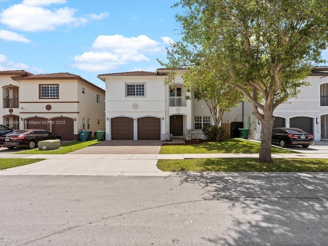 17616 SW 135th Ave, Miami, FL 33177 - mediterranean / spanish-style house featuring driveway, a balcony, stucco siding, a garage, and a front lawn