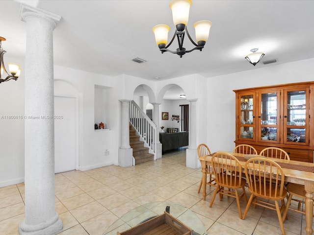 17616 SW 135th Ave, Miami, FL 33177 - dining area with ornate columns, a chandelier, arched walkways, and light tile patterned flooring